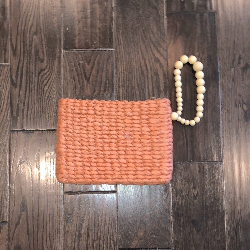 A new day straw wristlet with boho beaded handle